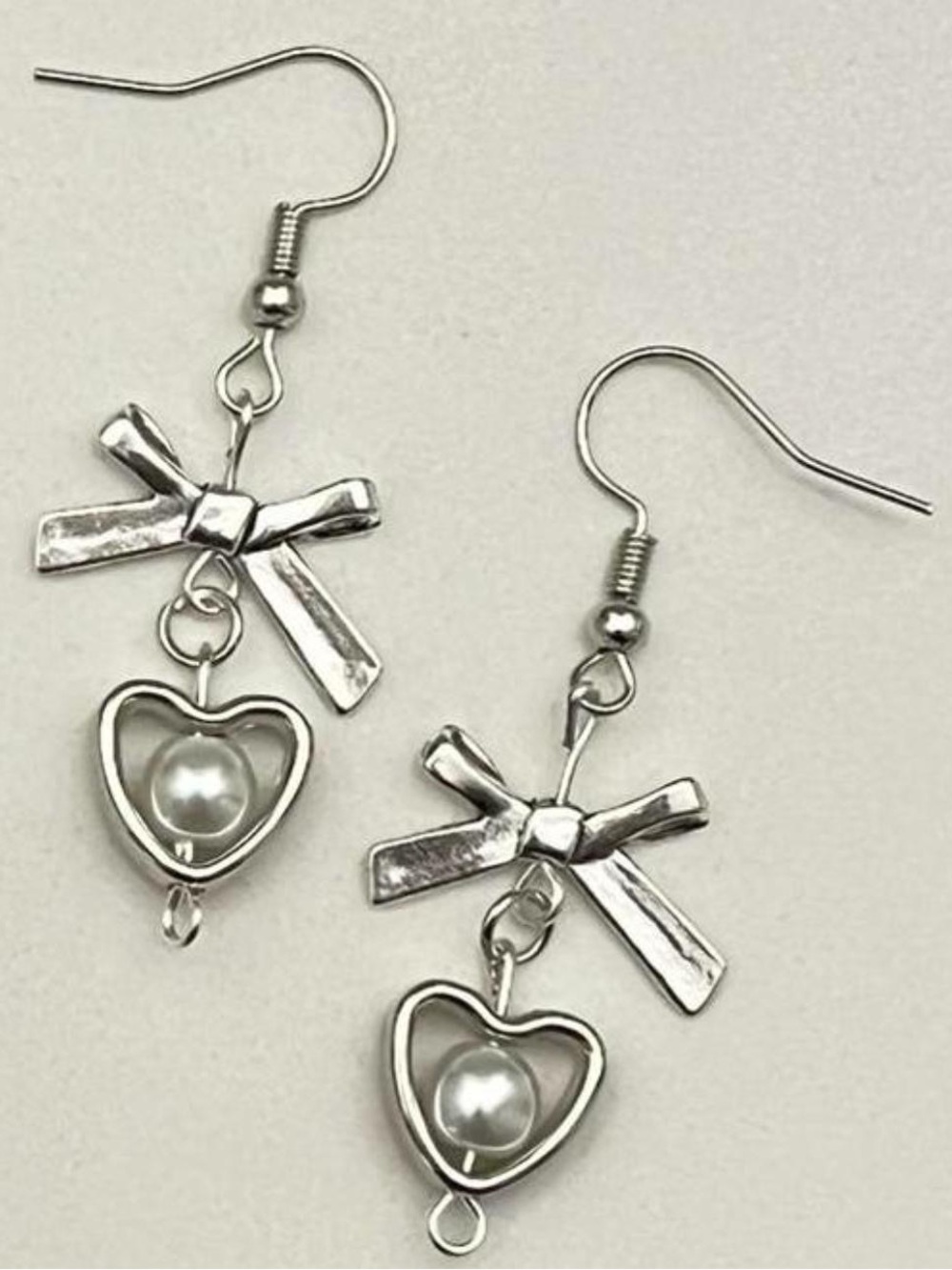 silver bow heart n pearl earrings